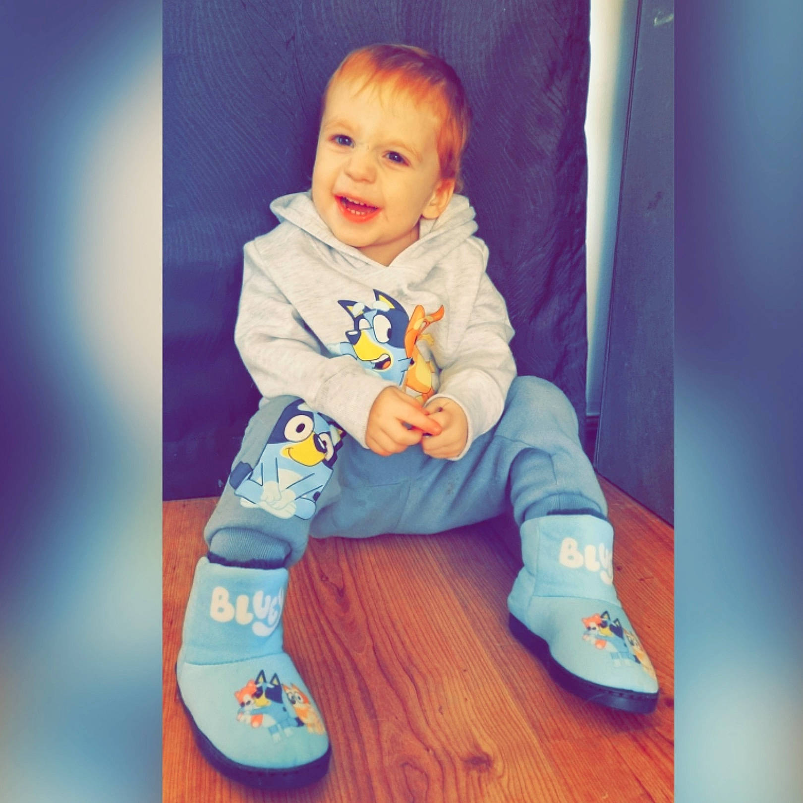 Levi is registered to the contest to win money with this photo: baby, baby_toddler_clothing, child, electric_blue, flooring, foot, happy, human_leg, joy, knee, pattern, person, product, purple, sitting, sleeve, smile, sock, sportswear, standing