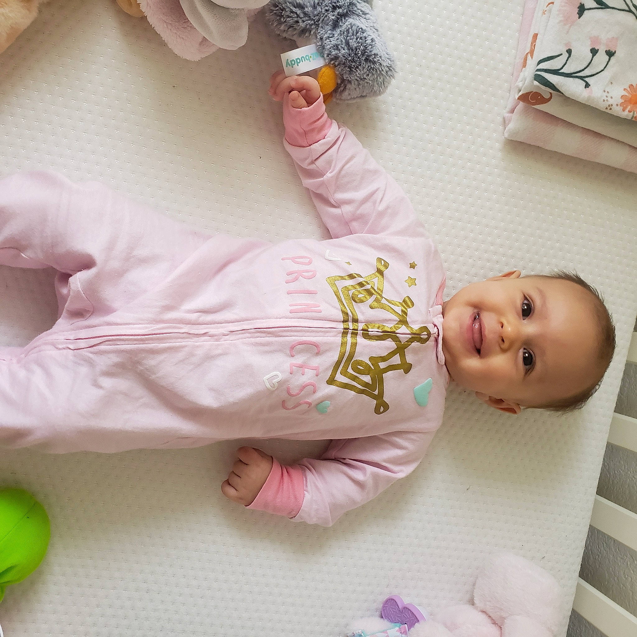 Jessica is registered to the contest to win money with this photo: arm, baby, baby_products, baby_toddler_clothing, baby_toys, cheek, child, comfort, finger, hand, happy, joy, leg, person, pink, room, skin, sleeve, textile, toddler