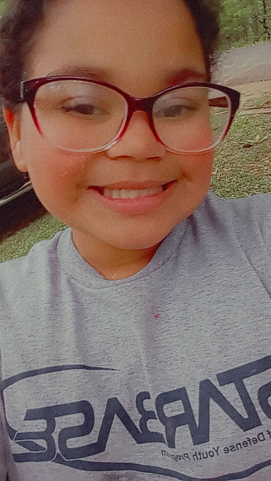 Leah is registered to the contest to win money with this photo: cheek, chin, cool, eyebrow, eyelash, eyewear, facial_expression, forehead, gesture, glasses, happy, jaw, joy, lip, mouth, neck, nose, person, skin, sleeve