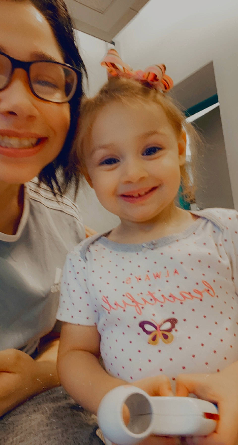 Ella is registered to the contest to win money with this photo: baby_toddler_clothing, cheek, eye, face, facial_expression, gesture, hair, hairstyle, happy, head, iris, joy, organ, person, pink, product, red, skin, sleeve, smile