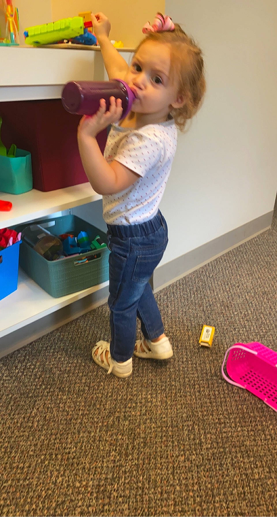 Ella is registered to the contest to win money with this photo: child, drawer, electric_blue, floor, flooring, fun, hardwood, human_leg, jeans, joint, knee, person, play, room, shoe, shoulder, smile, sneakers, standing, surprise