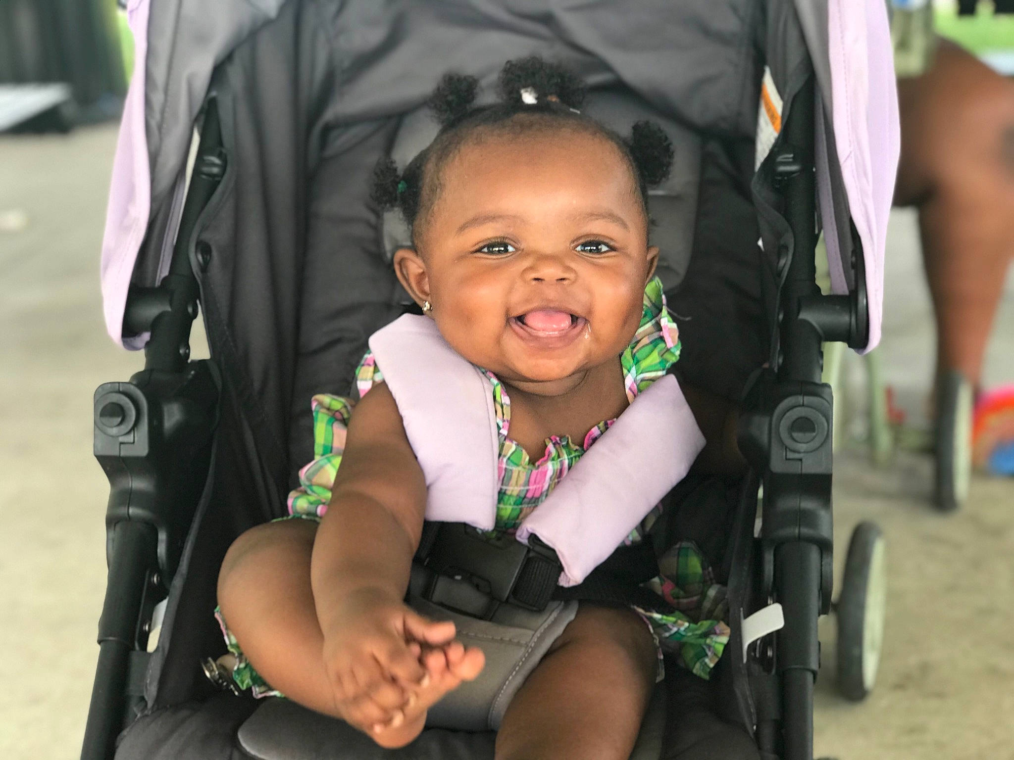 Maliyah is registered to the contest to win money with this photo: baby, baby_carriage, baby_products, baby_toddler_clothing, beauty, cheek, child, event, fun, grass, hairstyle, happy, iris, person, product, public_space, sitting, skin, smile, toddler