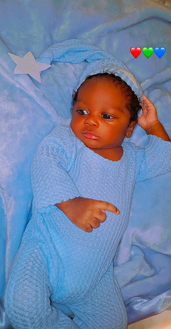 Desmond joined the competition — help win amazing prizes! baby, baby_products, baby_toddler_clothing, blue, cheek, child, comfort, electric_blue, eyebrow, fashion_accessory, flash_photography, happy, head, headgear, linens, nose, person, skin, sleeve, textile