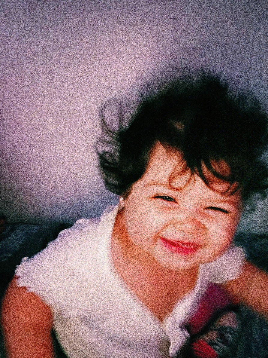 Khloe is registered to the contest to win money with this photo: baby, black_hair, cheek, comfort, eyebrow, eyelash, finger, flash_photography, forehead, gesture, happy, jaw, joy, lip, mouth, neck, nose, person, skin, smile