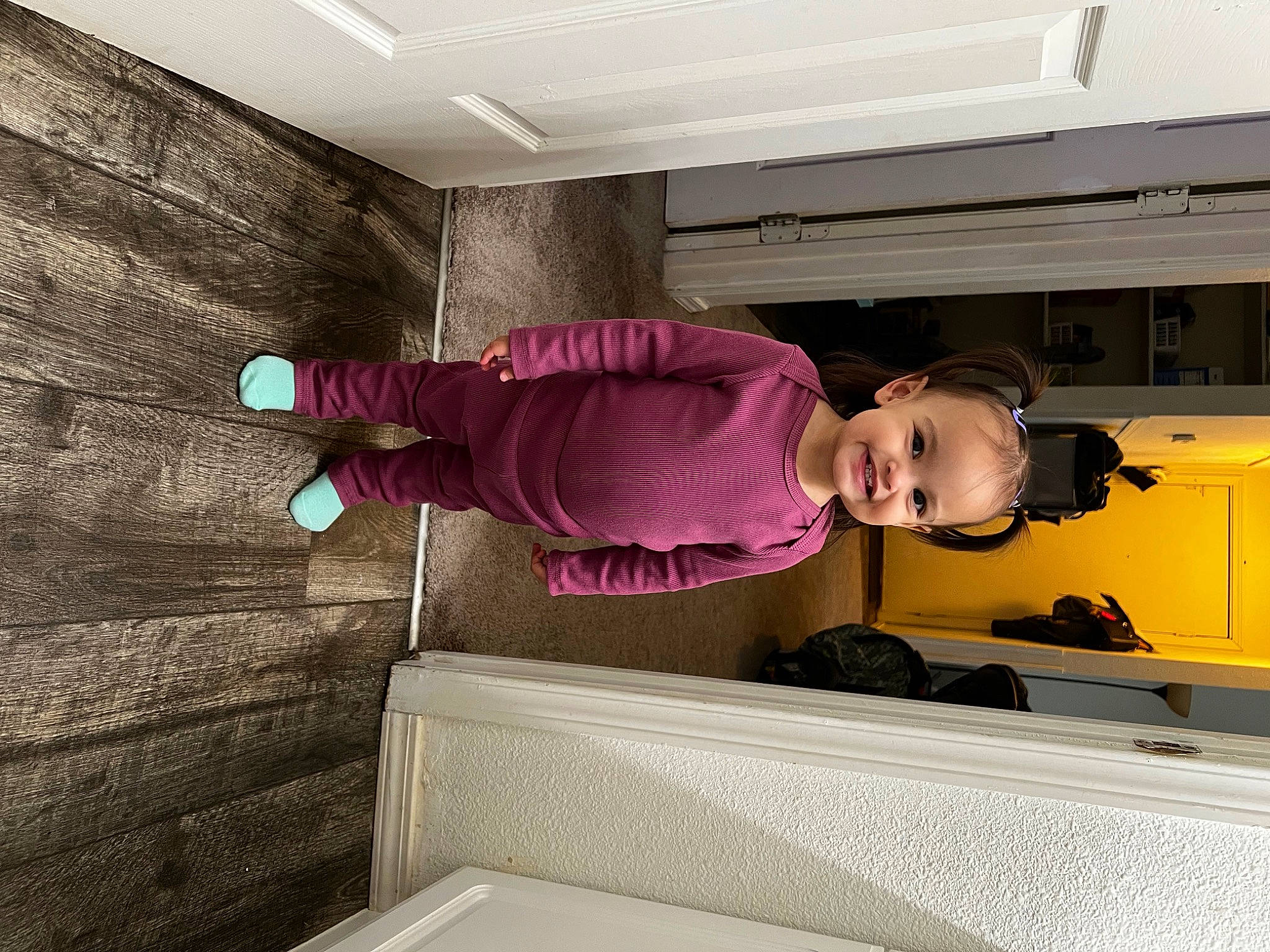 Luciana joined the competition — help win amazing prizes! automotive_exterior, ceiling, child, comfort, flooring, hardwood, hat, house, interior_design, jacket, joy, magenta, material_property, person, shirt, stairs, standing, t_shirt, toddler, vehicle