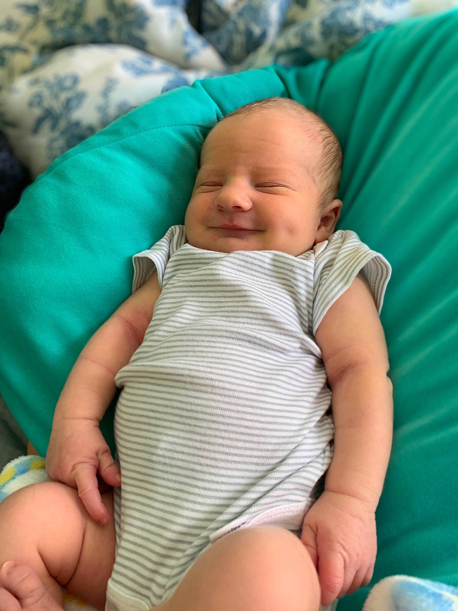 James is registered to the contest to win money with this photo: azure, baby, baby_toddler_clothing, cheek, child, comfort, eye, facial_expression, finger, grass, human_body, iris, joy, knee, leisure, mouth, person, skin, smile, stomach