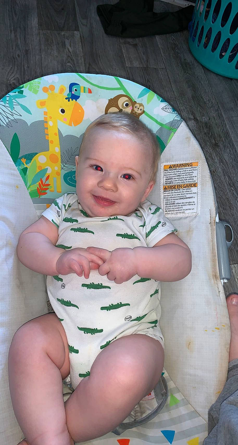 James is registered to the contest to win money with this photo: baby, baby_toddler_clothing, cheek, child, chin, eye, fun, green, hairstyle, happy, iris, joy, knee, mouth, organ, person, pink, skin, smile, stomach