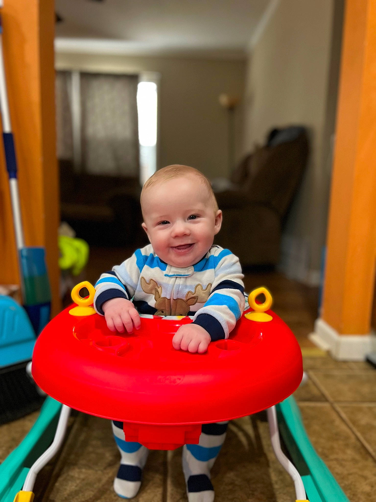 James joined the competition — help win amazing prizes! baby, baby_playing_with_toys, baby_products, baby_toddler_clothing, baby_toys, child, comfort, door, electric_blue, flooring, fun, happy, joy, leisure, person, play, recreation, riding_toy, room, sitting