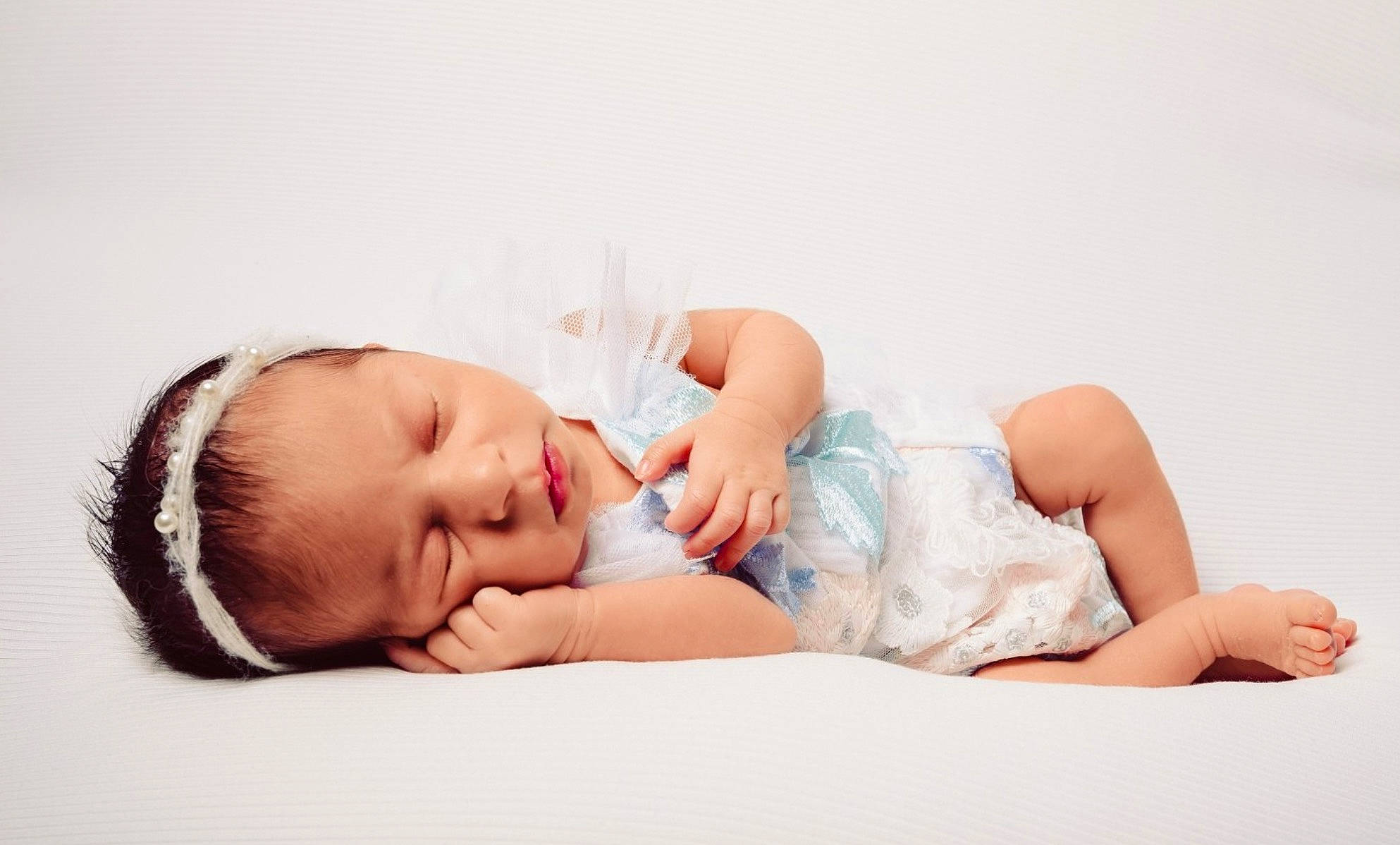 Star K is registered to the contest to win money with this photo: baby, baby_sleeping, baby_toddler_clothing, barefoot, child, comfort, eyelash, fashion_accessory, flash_photography, foot, happy, human_leg, knee, linens, neck, person, portrait_photography, sitting, skin, thigh