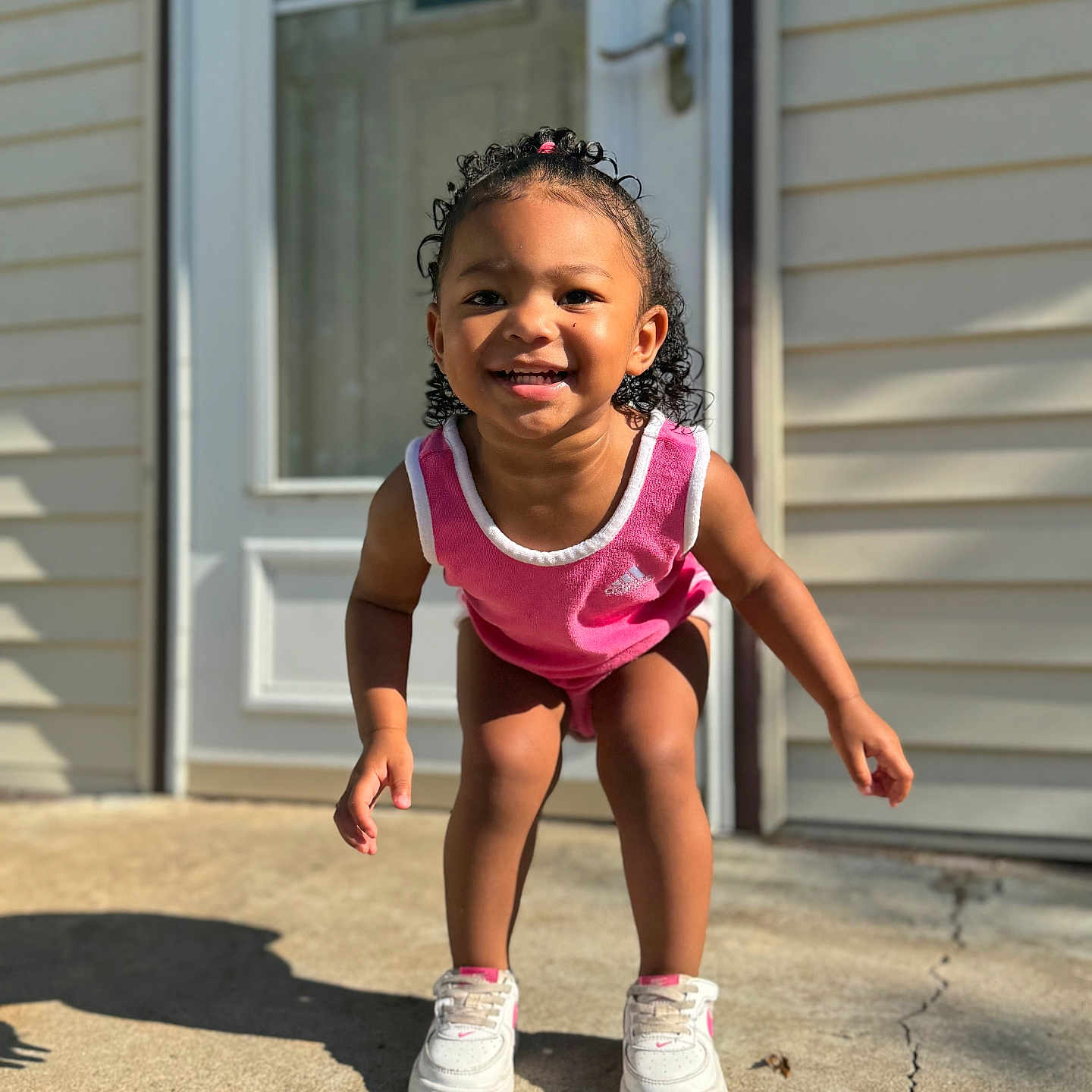 Alaysia is registered to the contest to win money with this photo: bodypart, child, clothing, dress, face, female, finger, footwear, girl, hand, happy, head, person, photography, portrait, shoe, shorts, sitting, smile, sneaker