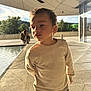 architecture, background, boy, casual_clothing, child, concrete, curious, daylight, family, jeans, modern, outdoor, person, pool, reflection, shadow, sunlight, sweater, urban, water