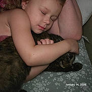 Amaya joined the competition — help win amazing prizes! child, sleeping, cat, hugging, bed, floral_bedspread, arm, face, pet, cozy, peaceful, indoor, closeup, person, animal, feline, resting, comfort, love, toddler