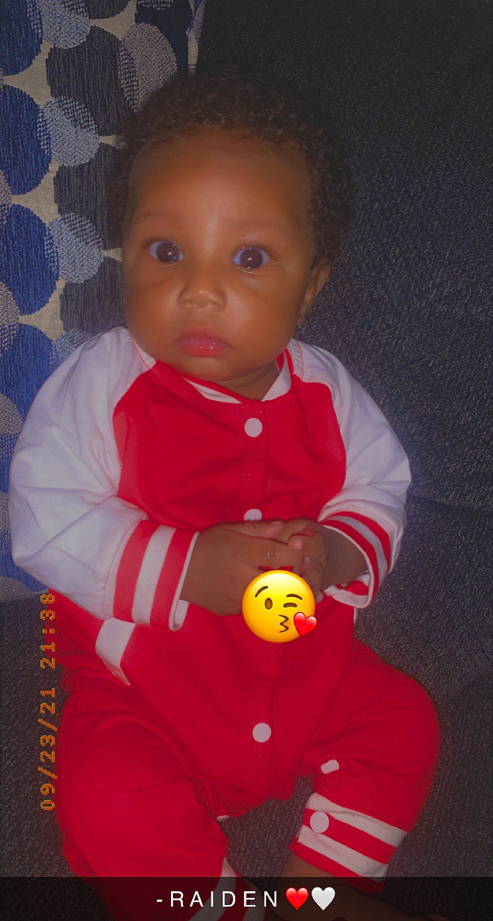 Raiden is registered to the contest to win money with this photo: baby, baby_products, baby_toddler_clothing, baby_toys, carmine, cheek, child, fictional_character, fun, happy, head, nose, orange, outerwear, person, personal_protective_equipment, sitting, sleeve, stuffed_toy, toddler