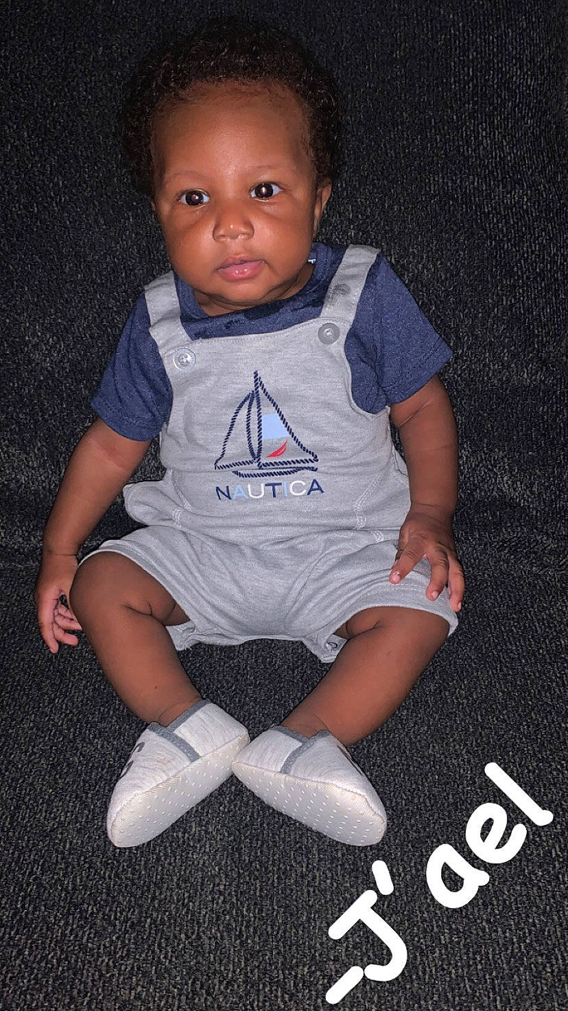 Raiden is registered to the contest to win money with this photo: baby, baby_toddler_clothing, carmine, cheek, child, cool, electric_blue, eye, face, flash_photography, fun, hand, happy, human_body, person, sitting, sleeve, smile, sportswear, t_shirt