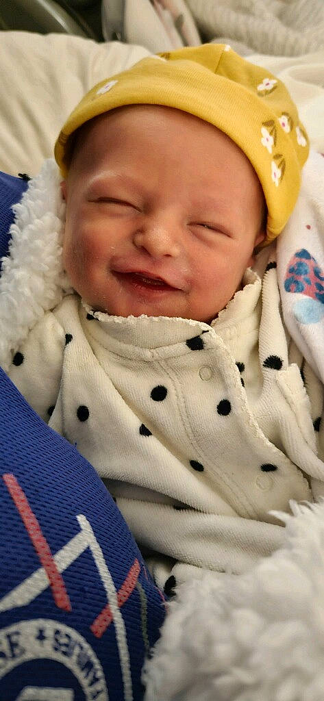 Iona is registered to the contest to win money with this photo: baby, baby_products, baby_toddler_clothing, cap, cheek, child, collar, event, face, fun, gesture, happy, hat, joy, laugh, pattern, person, skin, sleeve, smile