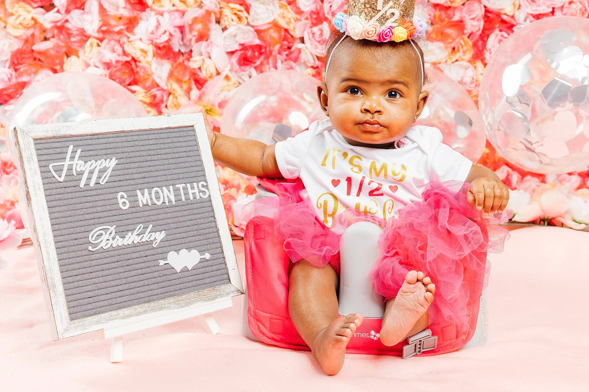 Melanie is registered to the contest to win money with this photo: baby, baby_toddler_clothing, birthday, child, design, event, face, fashion_accessory, font, fun, happy, holiday, magenta, party_supply, peach, person, pink, product, red, sitting