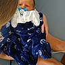 baby, child, newborn, pacifier, blanket, navy_blue, anchors, holding, couch, legs, hair, face, infant, indoor, person, blue, comfort, cute, family, toddler