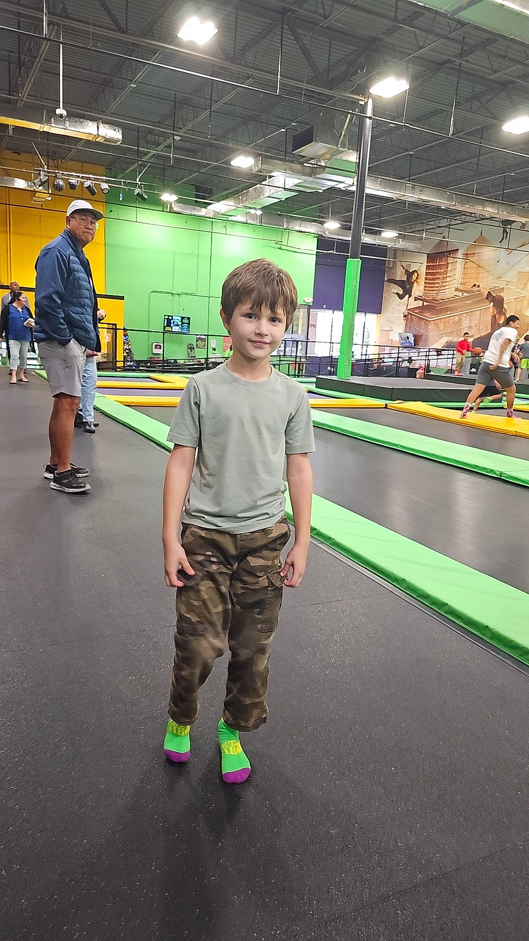 Luka is registered to the contest to win money with this photo: child, engineering, event, flooring, fun, games, hall, headwear, indoor_games_and_sports, joy, leisure, machine, person, play, recreation, recreation_room, shorts, smile, sports, sweatpant