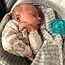 Cristian is registered to the contest to win money with this photo: baby, newborn, sleeping, blanket, pacifier, infant, cute, soft, cozy, onesie, animal_print, hand, face, rest, peaceful, indoors, bed, comfort, child, portrait