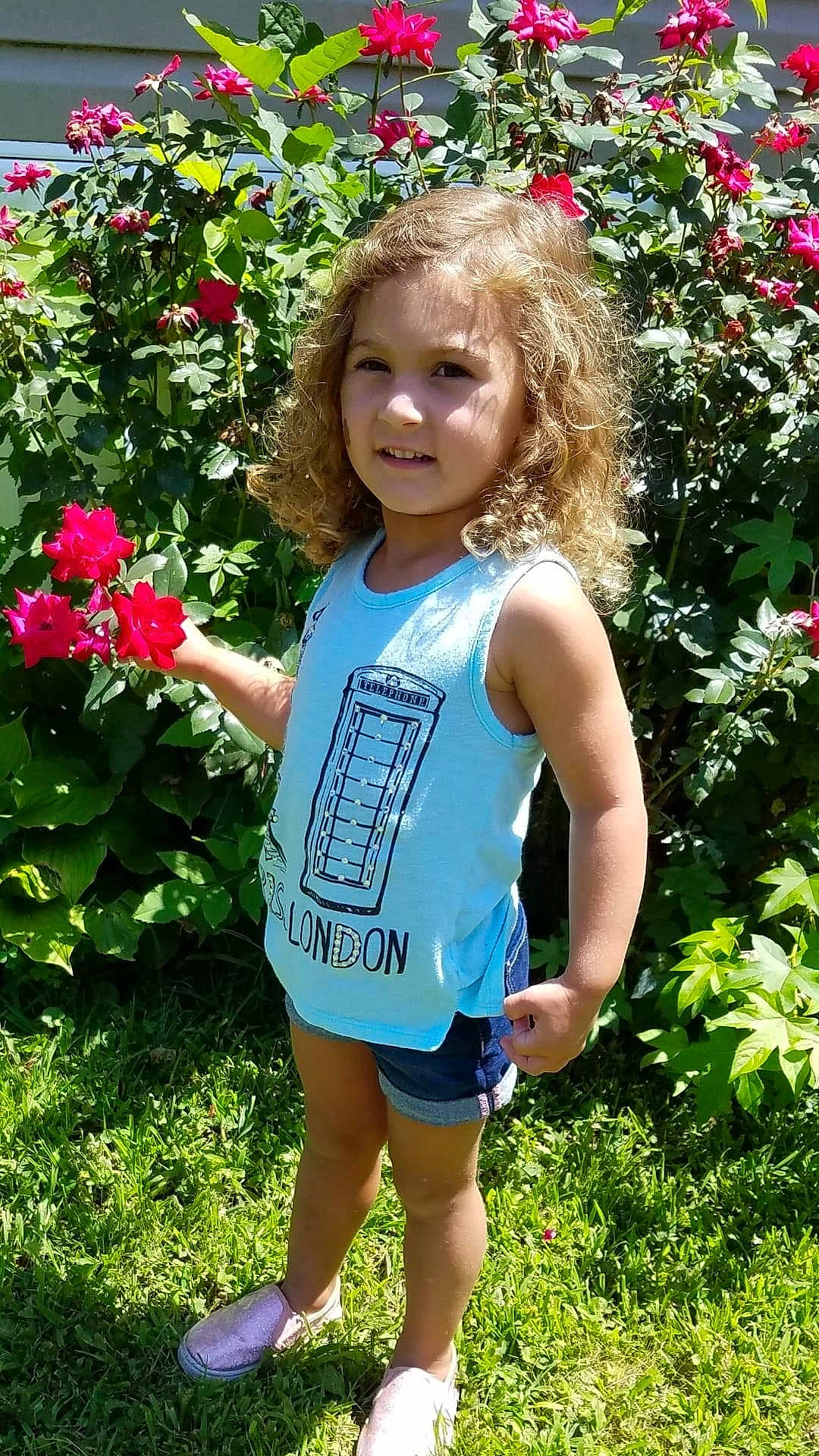 Kiera joined the competition — help win amazing prizes! annual_plant, baby_toddler_clothing, botany, child, face, flower, grass, happy, head, leaf, nature, people_in_nature, person, petal, pink, plant, shrub, smile, summer, toddler