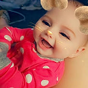 Chloe is registered to the contest to win money with this photo: baby, child, smiling, pink_clothing, polka_dots, face_filter, bear_ears, whiskers, nose, digital_effects, happy, cute, infant, closeup, portrait, indoor, human, baby_girl, joyful, playful