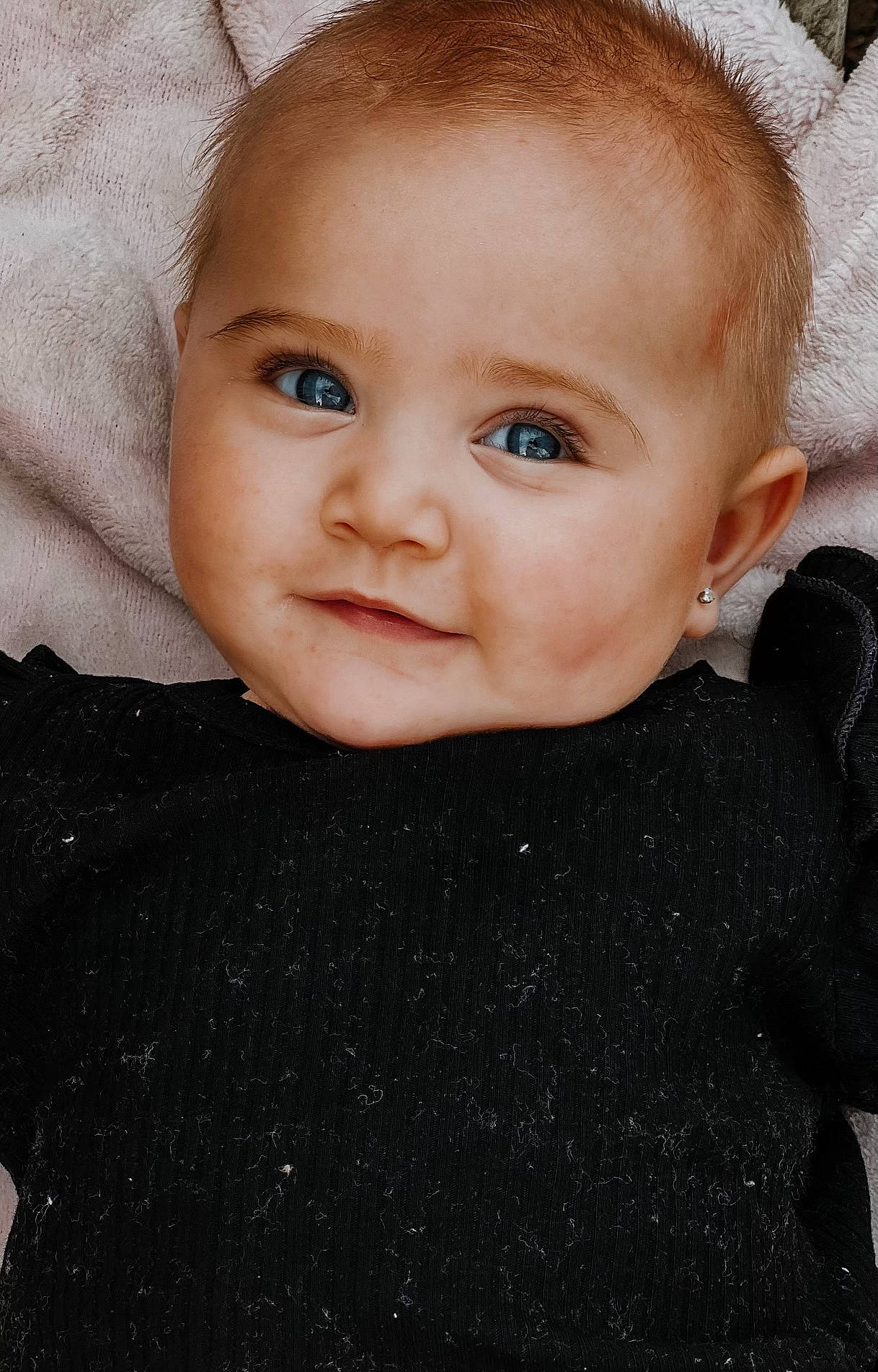Macie is registered to the contest to win money with this photo: baby, baby_toddler_clothing, cheek, child, electric_blue, eyelash, flash_photography, fun, happy, head, iris, lip, neck, nose, pattern, person, portrait_photography, skin, sleeve, smile