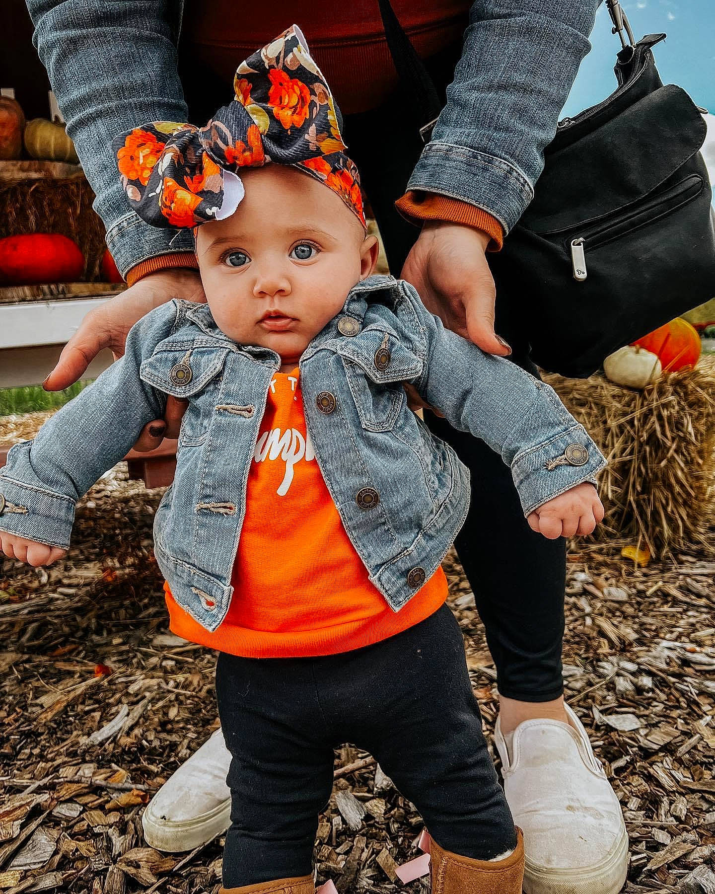 Macie is registered to the contest to win money with this photo: baby, baby_toddler_clothing, cap, child, cool, fashion_accessory, fun, gesture, grass, happy, headwear, leisure, orange, pattern, people_in_nature, person, pumpkin, sitting, sleeve, soil
