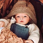 Milo participe au concours pour gagner de l'argent avec cette photo : baby, baby_wear, blanket, child, clothing, cozy, cute, denim_overalls, dinosaur_hood, face, giraffe_toy, hand, hood, indoor, infant, portrait, soft_texture, stroller, toy, warm
