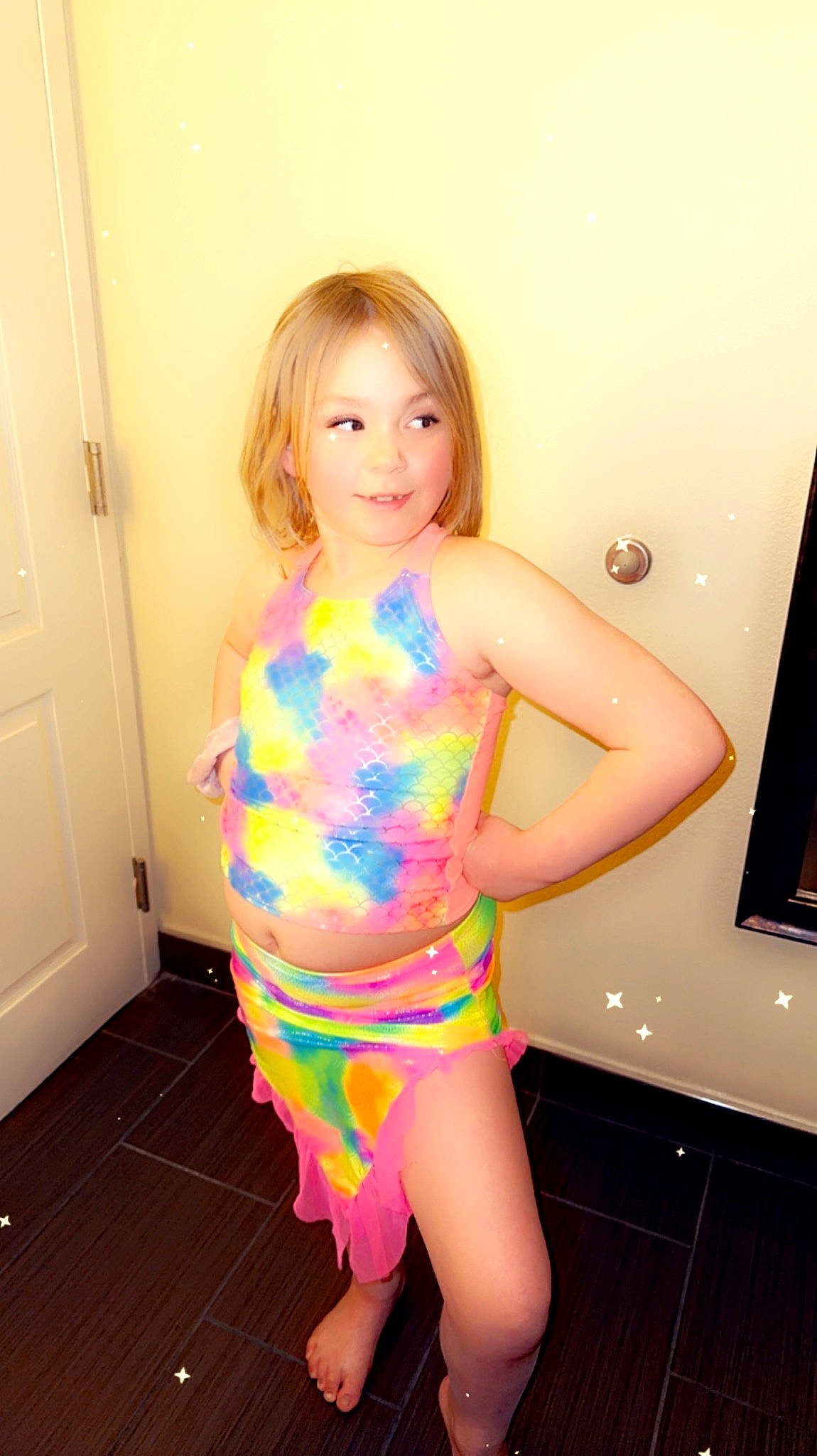 Braelynn Jade is registered to the contest to win money with this photo: abdomen, blond, brown_hair, chest, door, electric_blue, finger, fun, human_leg, joy, leg, magenta, one_piece_swimsuit, person, pink, shoulder, smile, swimwear, thigh, toddler