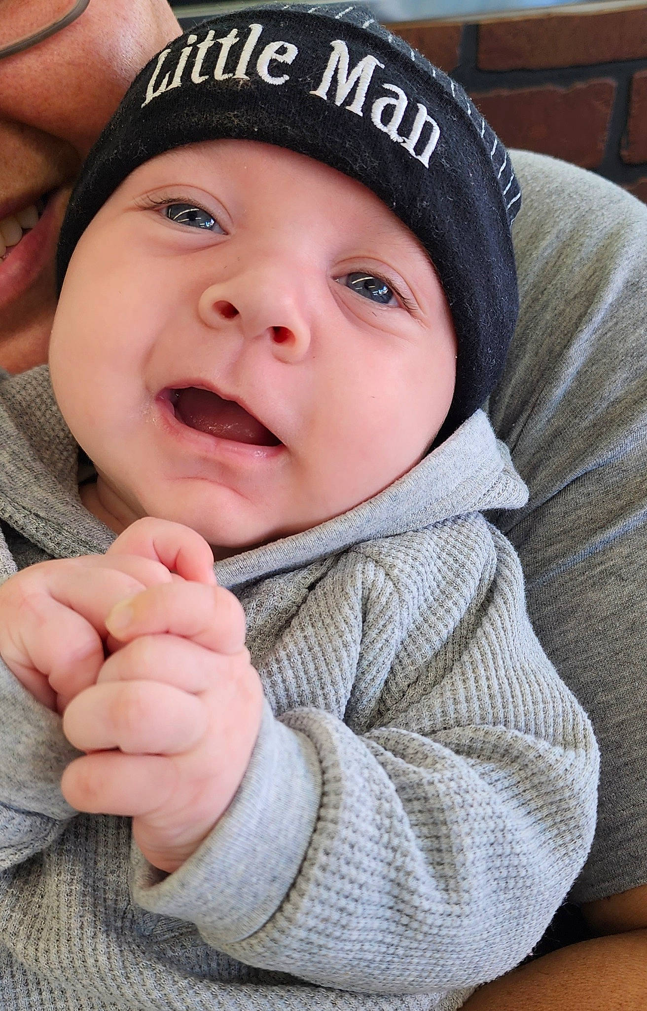 Leo is registered to the contest to win money with this photo: baby, beanie, cap, cheek, child, fashion_accessory, gesture, happy, hat, headgear, headwear, knit_cap, lip, outerwear, person, portrait_photography, skin, sleeve, smile, thumb