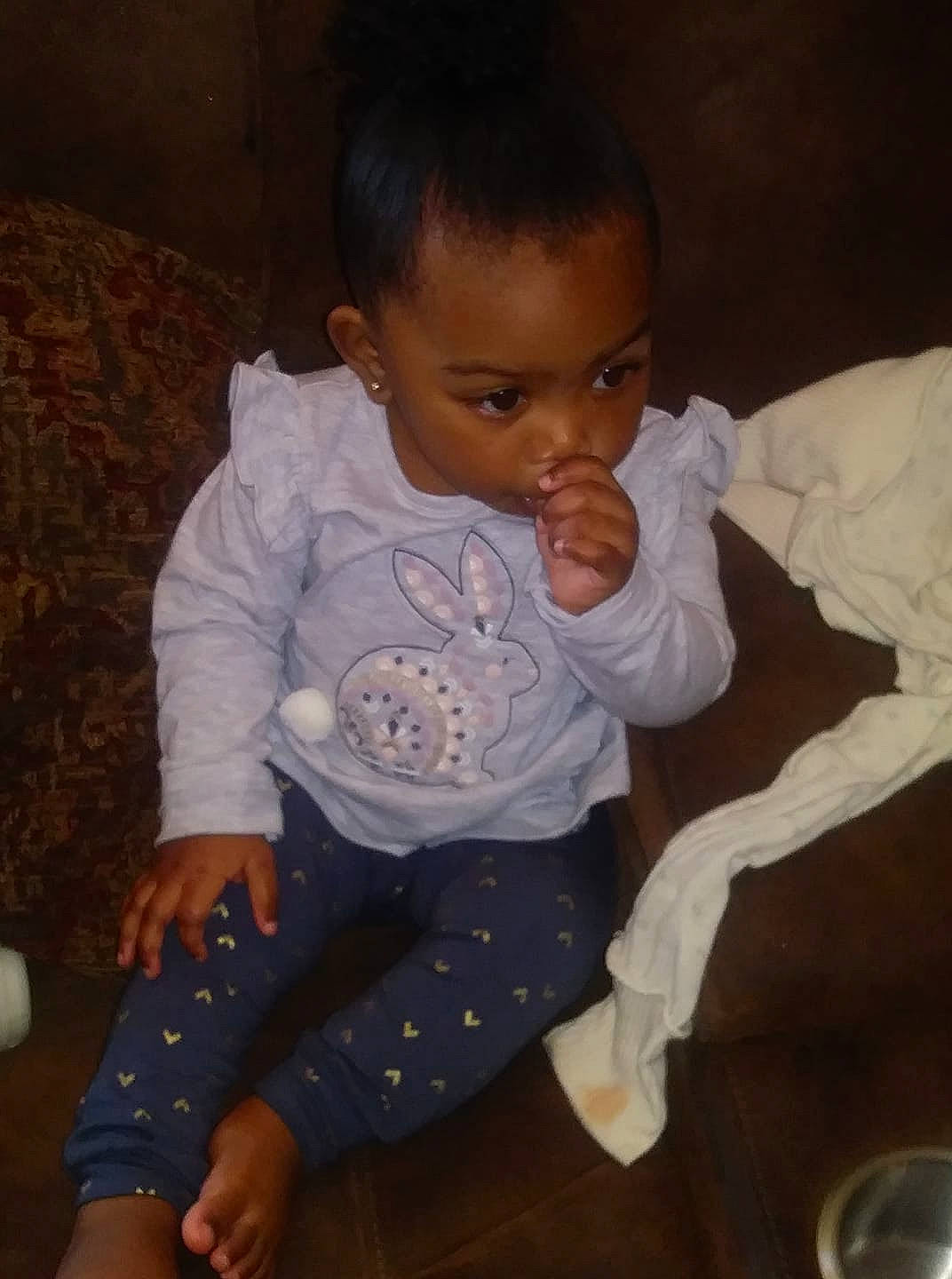 Dreambella is registered to the contest to win money with this photo: arm, baby, black_hair, cheek, child, electronic_device, eye, face, fun, head, human, iris, leg, lip, nose, person, sitting, skin, smile, toddler