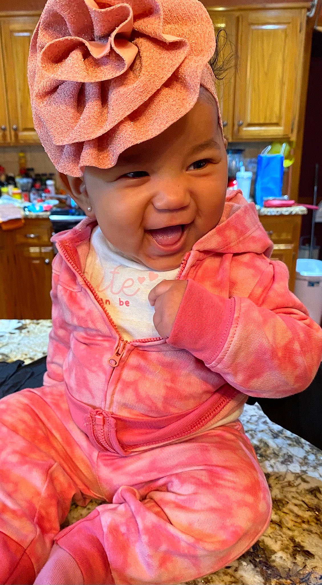 Mariyah joined the competition — help win amazing prizes! baby, baby_toddler_clothing, blue, cap, cheek, child, chin, eye, happy, head, headwear, human_body, lip, mouth, nose, orange, people, person, pink, skin