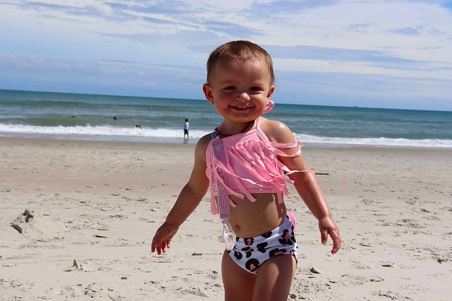 Finley joined the competition — help win amazing prizes! beach, child, cloud, coast, fun, happy, holiday, joy, leisure, ocean, people_in_nature, people_on_beach, person, sand, shore, sky, smile, swimwear, thigh, toddler