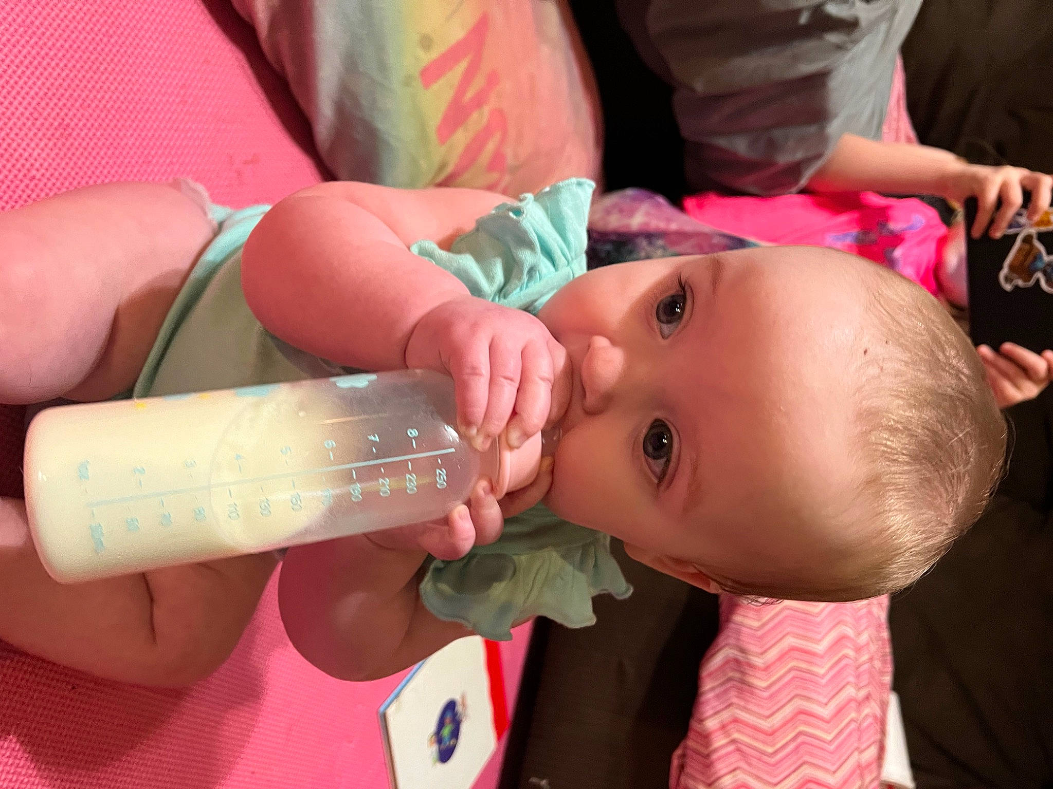 Erabella is registered to the contest to win money with this photo: baby, cheek, chin, drinkware, ear, eye, eyelash, finger, happy, iris, joint, lip, mouth, neck, nose, person, pink, plastic_bottle, product, skin