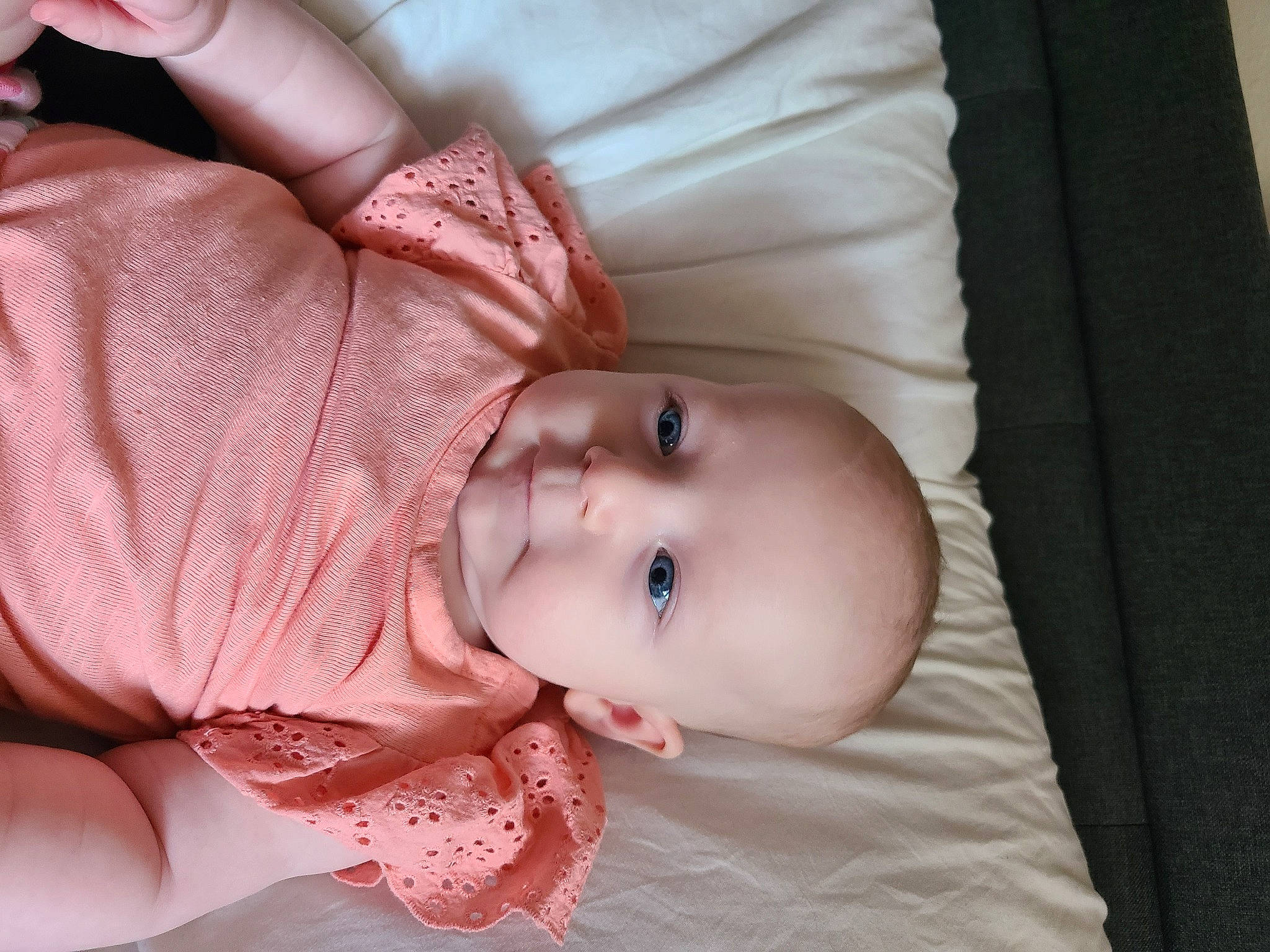 Scarlett Grace is registered to the contest to win money with this photo: arm, baby, baby_toddler_clothing, cheek, chin, eye, eyebrow, eyelash, hand, human_body, iris, lip, mouth, neck, nose, outerwear, person, pink, skin, sleeve