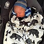 newborn, baby, sleeping, blanket, bear_pattern, car_seat, hat, mittens, cozy, child, infant, side_impact_protection, black, white, blue, striped, soft, cute, resting, safety