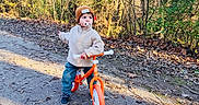 Sahïr a rejoint le concours — aidez-le/la à gagner de superbes lots ! autumn, balance_bike, beanie, child, curious, daylight, forest, jacket, leaves, nature, outdoor, pacifier, pants, path, playtime, shoes, toddler, trees, walking, young_child