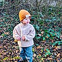 toddler, child, outdoor, forest, leaves, greenery, beanie, fleece, pants, shoes, nature, winter, curious, standing, clothing, person, young_child, autumn, ground, plants