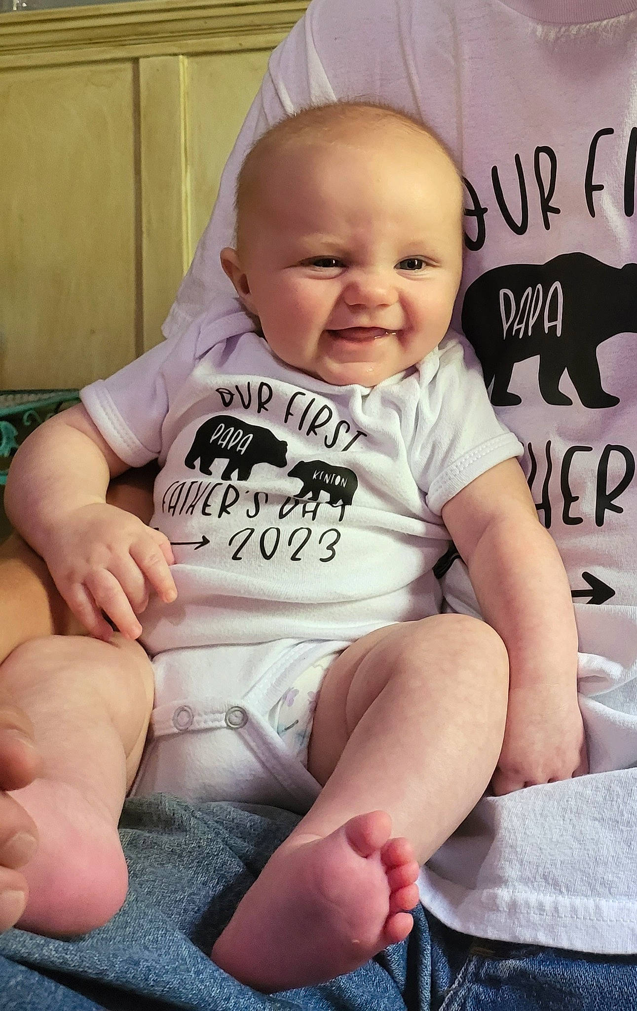 Kenton is registered to the contest to win money with this photo: baby, baby_toddler_clothing, cheek, child, comfort, finger, hairstyle, happy, head, joy, knee, person, pink, sitting, skin, sleeve, smile, stomach, t_shirt, thigh