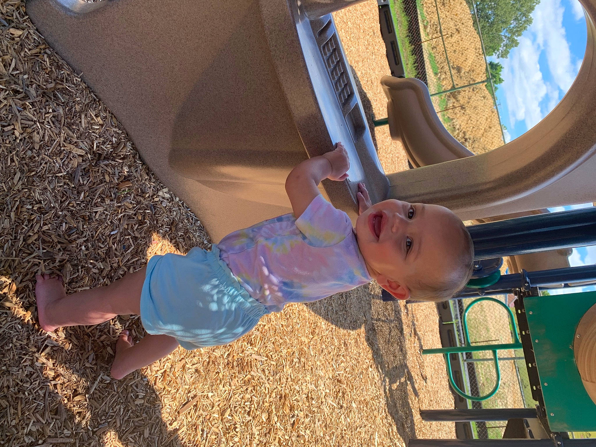 Zariya is registered to the contest to win money with this photo: automotive_tire, child, city, electric_blue, fun, happy, human_body, leg, leisure, outdoor_play_equipment, person, playground, recreation, smile, sneakers, soil, t_shirt, tire, toddler, tree