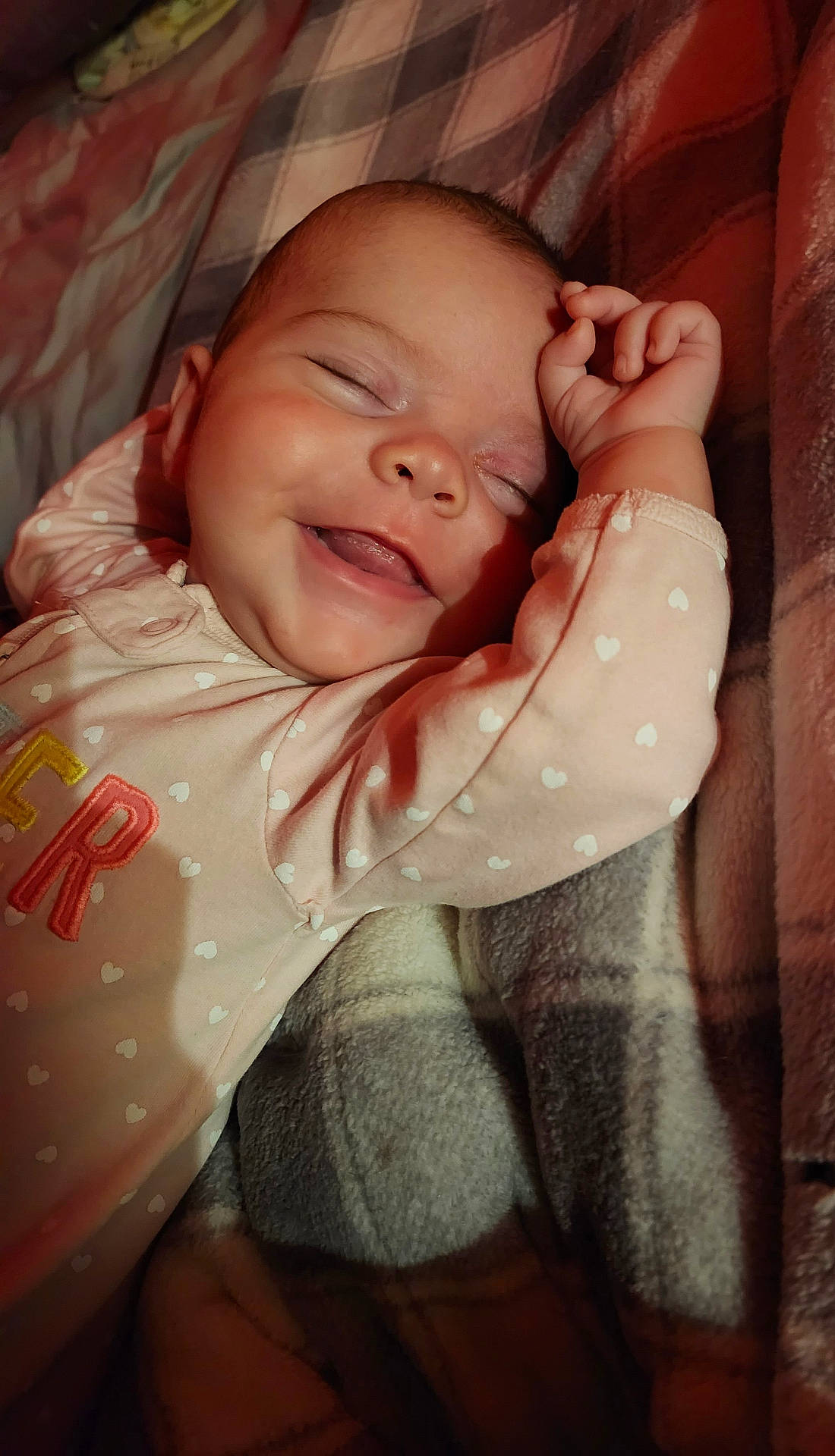 Harper is registered to the contest to win money with this photo: baby, bed, blanket, bodypart, clothing, cushion, face, finger, furniture, hand, happy, head, homedecor, newborn, person, photography, portrait, quilt, sleeping, smile