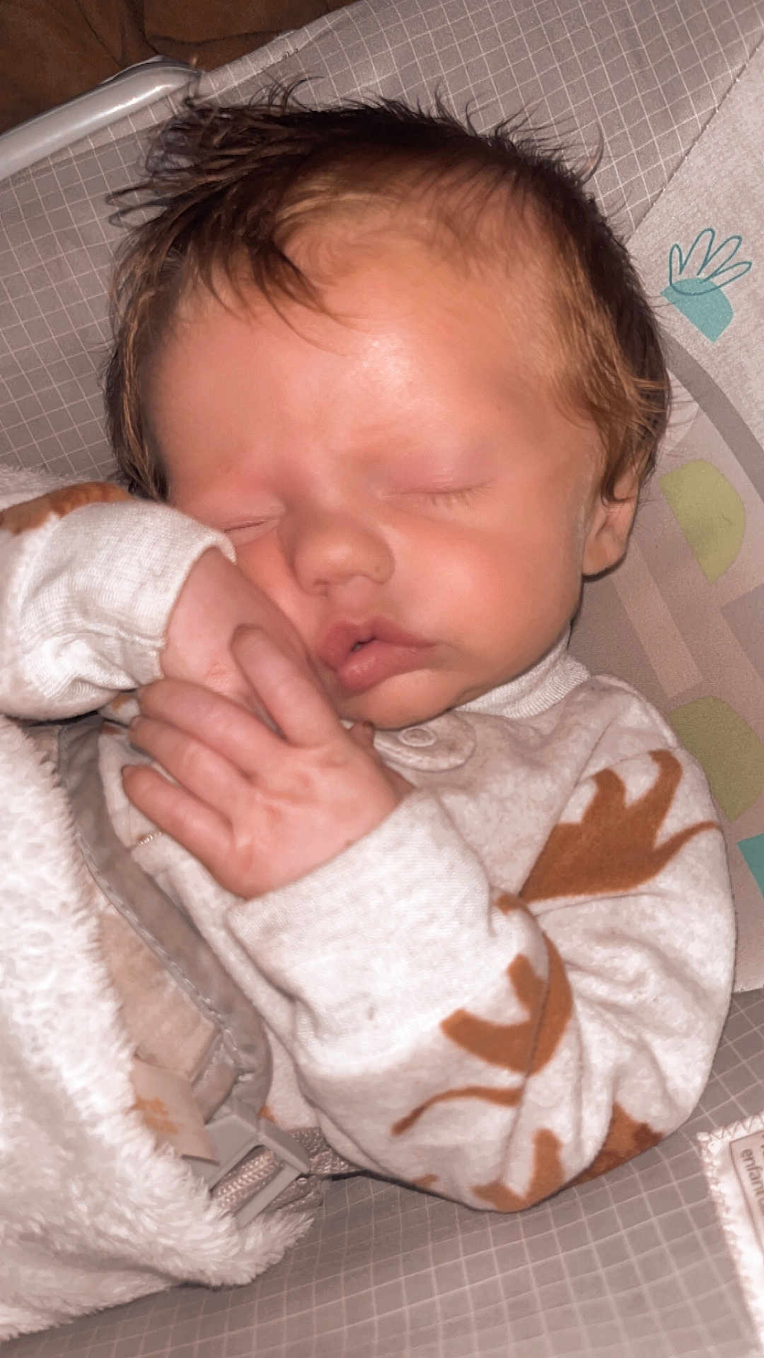 Jaydean is registered to the contest to win money with this photo: baby, sleeping, blanket, onesie, infant, cozy, face, hand, peaceful, child, cute, rest, soft, seat, pattern, indoors, newborn, closeup, portrait, comfort