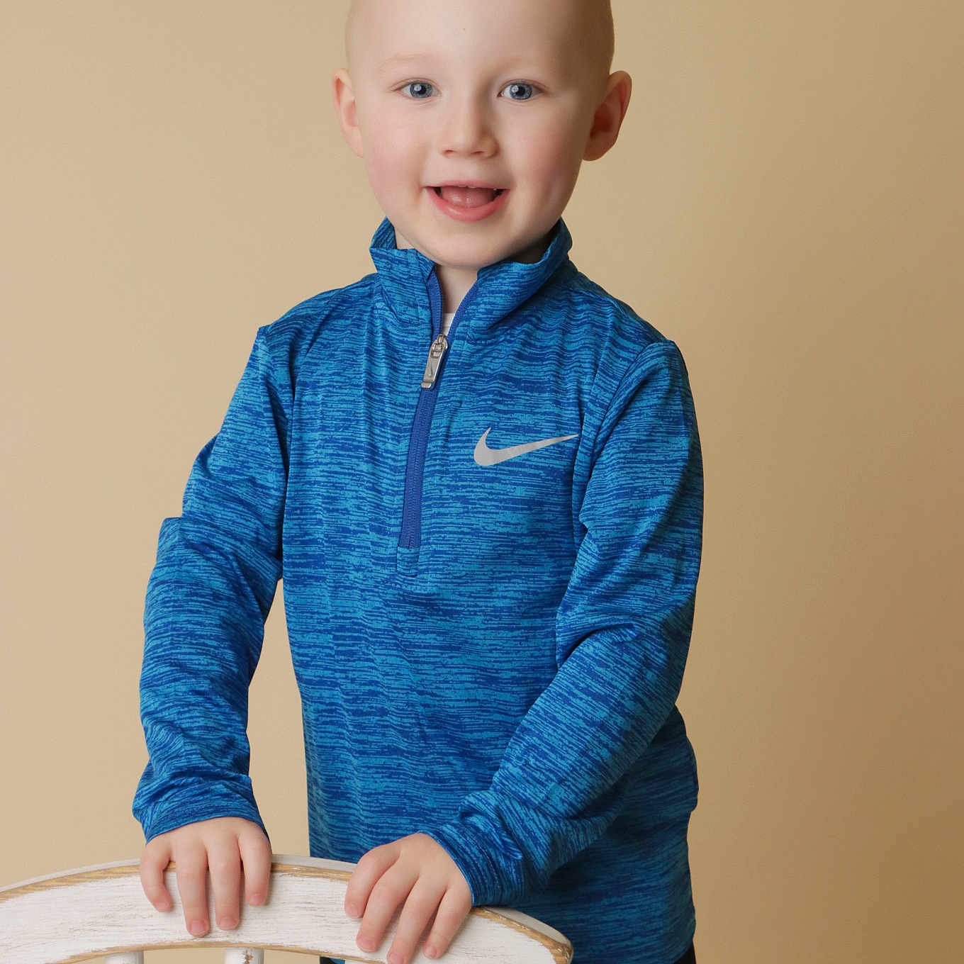 Hunter is registered to the contest to win money with this photo: bodypart, boy, chair, child, clothing, face, finger, hand, head, knitwear, longsleeve, male, pants, person, photography, portrait, shirt, sleeve, sweater, sweatshirt