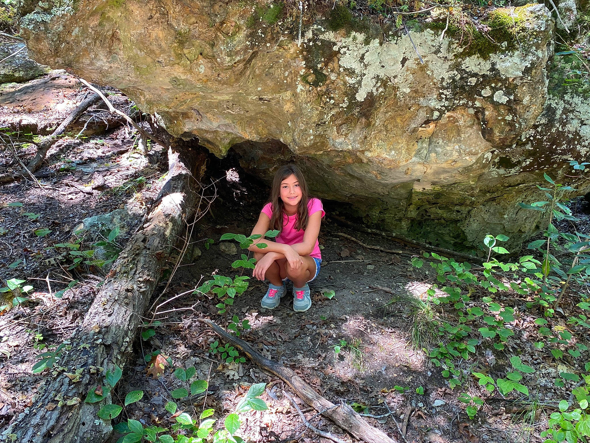 Rylee is registered to the contest to win money with this photo: adventure, bedrock, erosion, fault, fawn, forest, formation, geological_phenomenon, geology, joy, jungle, organism, outcrop, person, plant, recreation, rock, tree, vacation