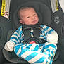 Greyson joined the competition — help win amazing prizes! baby, infant, car_seat, blue_striped_clothing, onesie, child, safety_harness, seat_belt, newborn, face, soft_lighting, indoor, warning_labels, fabric, head_support, cute, small_hands, padded_seat, resting, seat