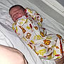 newborn, baby, sleeping, onesie, clothing, blanket, bed, hand, infant, cozy, rest, cute, pattern, food, pretzel, pizza, soft, portrait, indoors, peaceful
