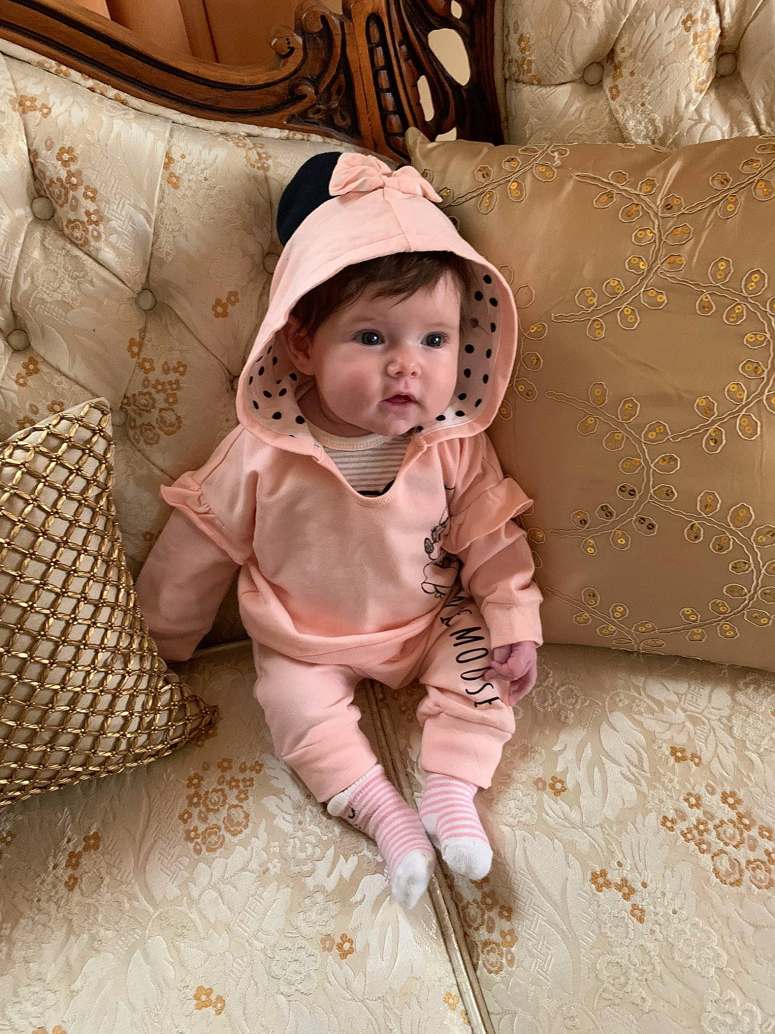 Kylie is registered to the contest to win money with this photo: baby, child, child_model, fur, headgear, outerwear, person, pink, skin, sleeve, toddler