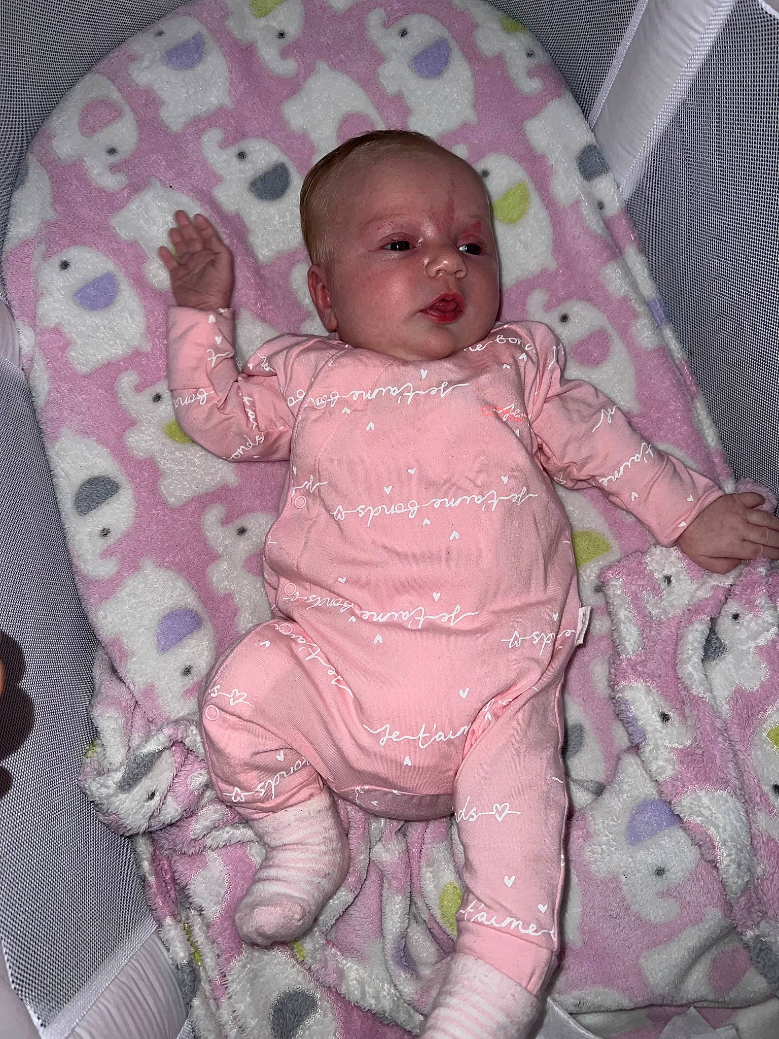 Arabella is registered to the contest to win money with this photo: abdomen, baby, baby_products, baby_toddler_clothing, baby_toys, bottle, cheek, chest, child, comfort, foot, head, iris, linens, pattern, person, pink, room, sitting, sleeve