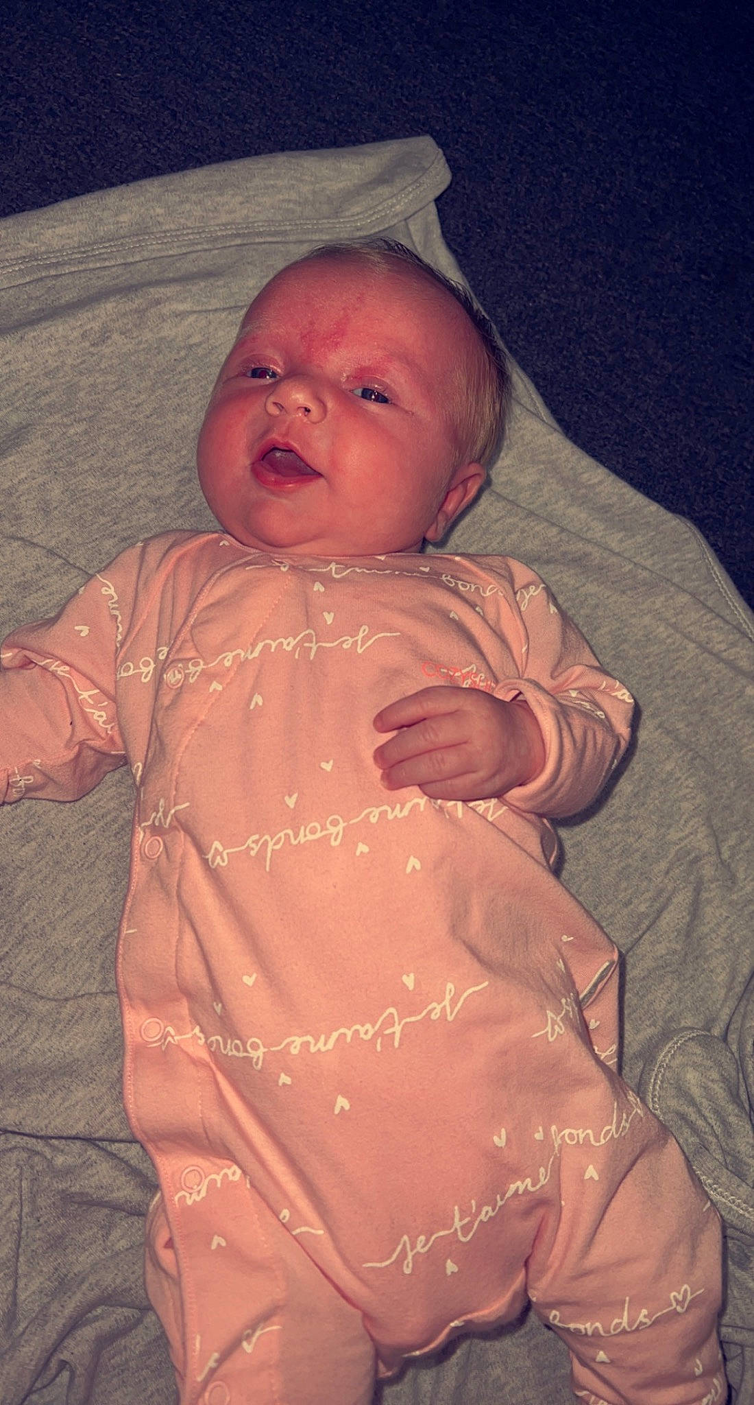 Arabella is registered to the contest to win money with this photo: arm, baby, brown, cheek, chin, comfort, eye, finger, forehead, gesture, hand, human_body, iris, lip, mouth, nose, person, pink, skin, sleeve