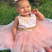 Skylynn Dream joined the competition — help win amazing prizes! baby, blanket, celebration, child, crown, cute, dress, festive, flower, fun, grass, happy, headband, nature, outdoor, pink, portrait, seated, smiling, toddler